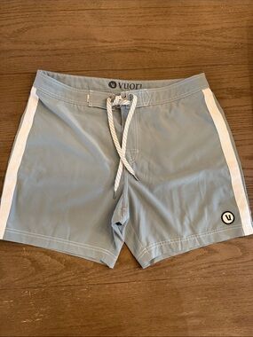 Vuori Light Blue Swim Shorts with White Side Stripes